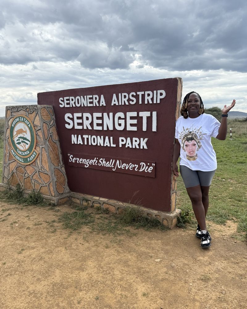 Valicia at the Serengeti National Park sign
